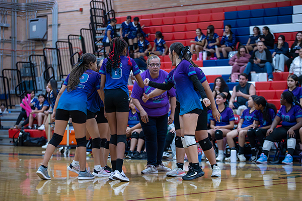 The Pueblo Gardens volleyball team goes in for a huddle