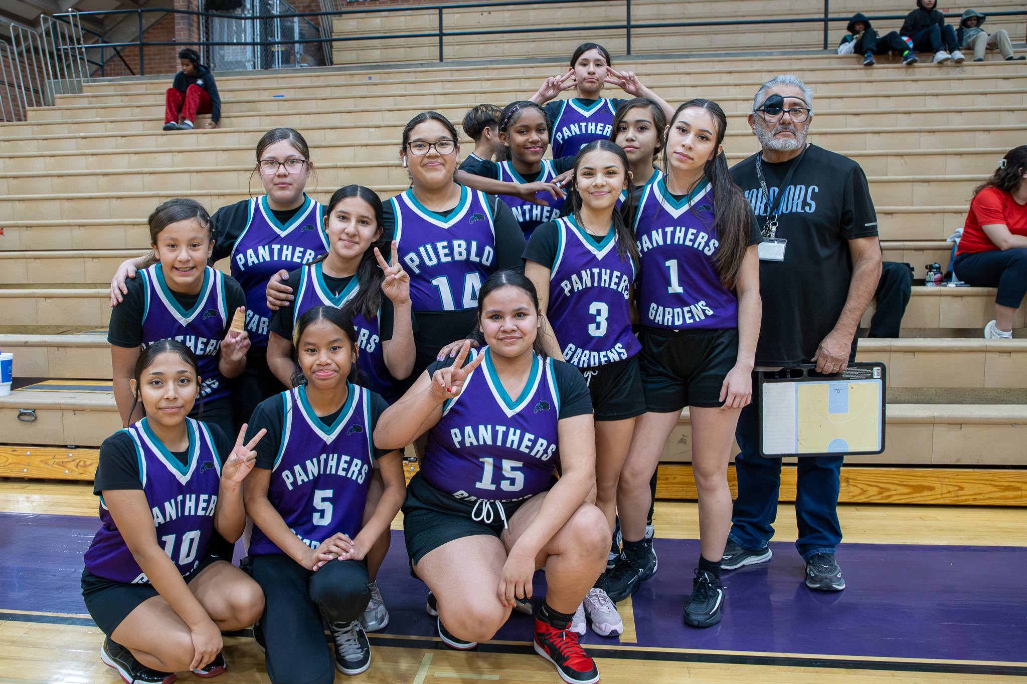The Pueblo Gardens girls basketball team poses for a group photo