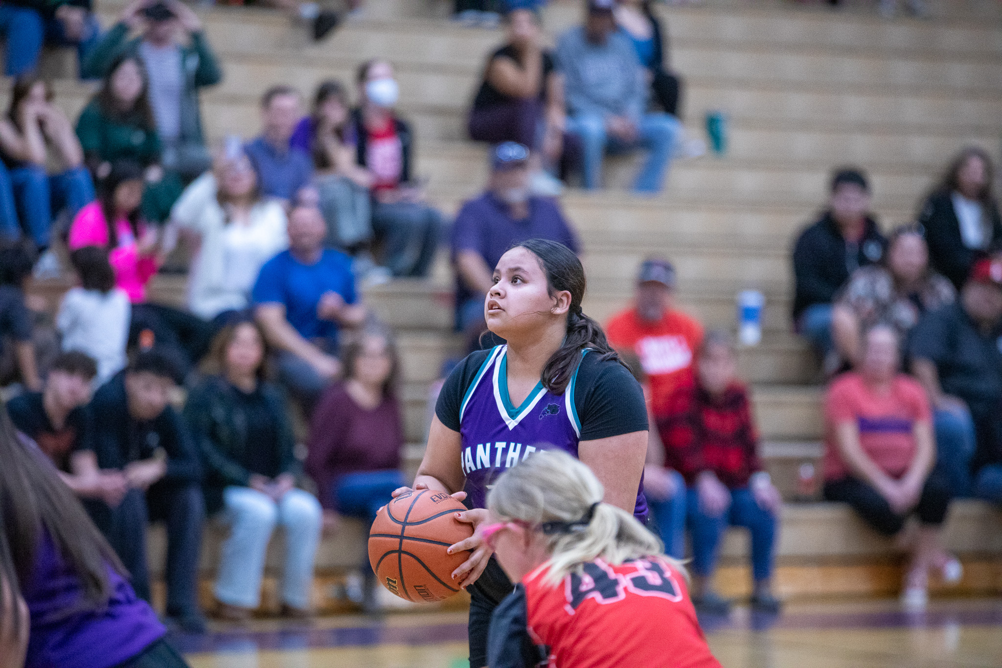 A Pueblo Gardens girl gets ready to shoot a basket