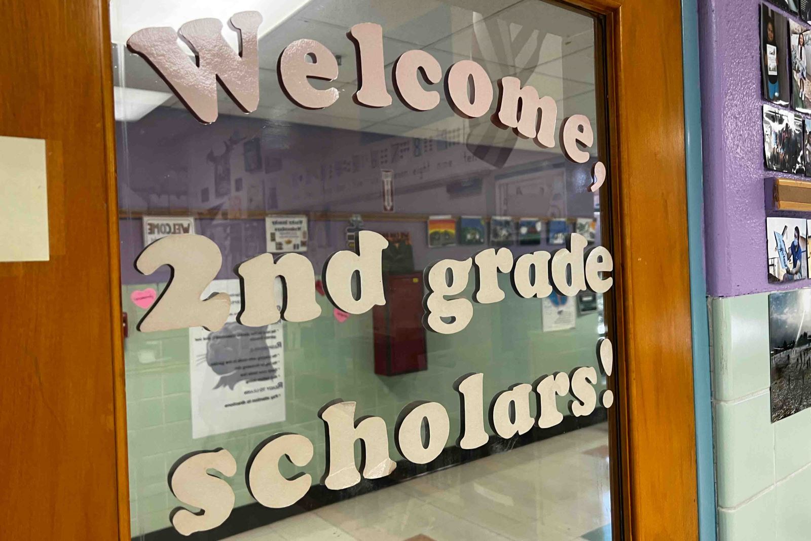 A door sign welcomes 2nd grade scholars to their first day of class